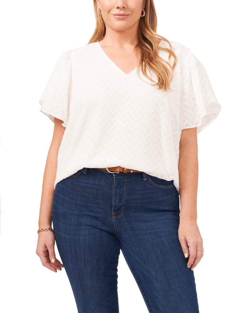 Front of a model wearing a size 1X Nala Chevron Burnout Blouse in 103-NEW IVORY by Vince Camuto. | dia_product_style_image_id:261557